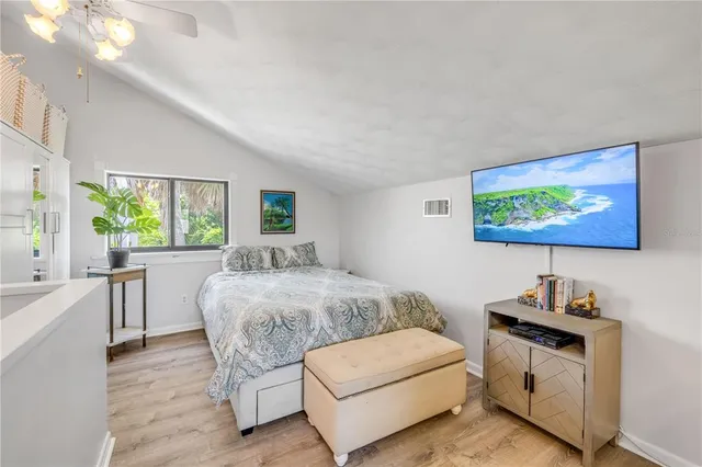 a kitchen with stainless steel appliances kitchen island granite countertop a table and chairs next to a window