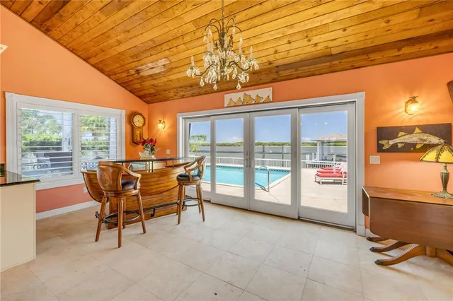 a very nice looking room with a large window and furniture