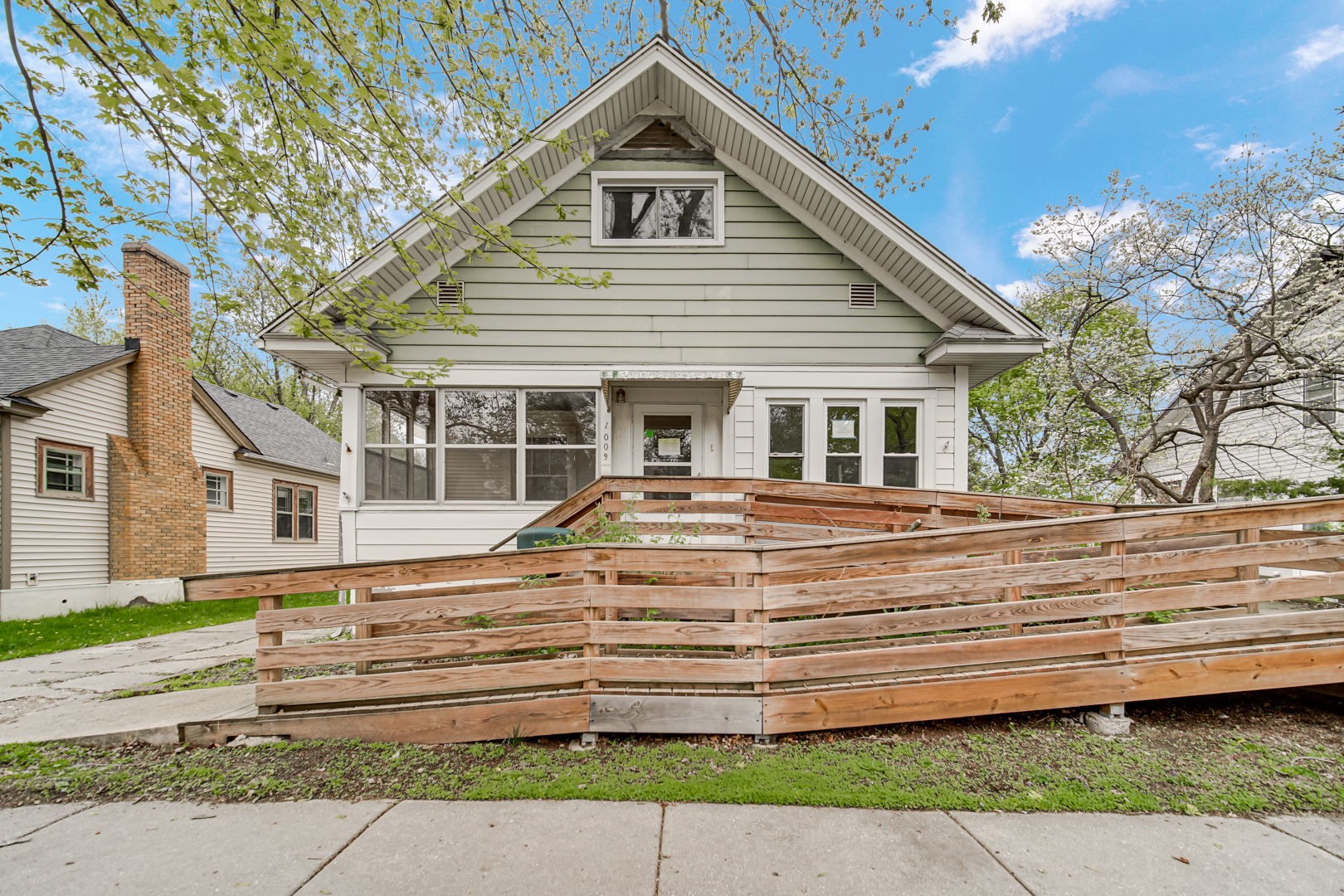 1009 Augusta Avenue Elgin, IL 60120 - Photo 1 of 24 a front view of a house with a yard