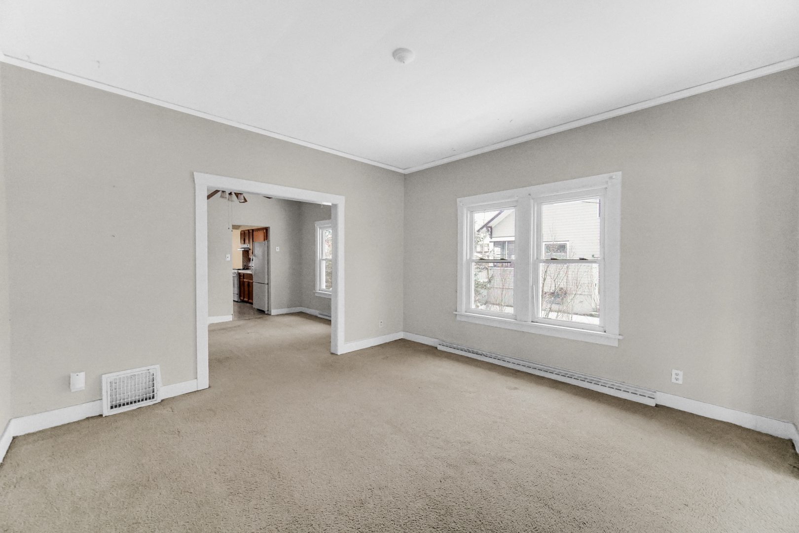 1009 Augusta Avenue Elgin, IL 60120 - Photo 5 of 24 a view of an empty room with a window