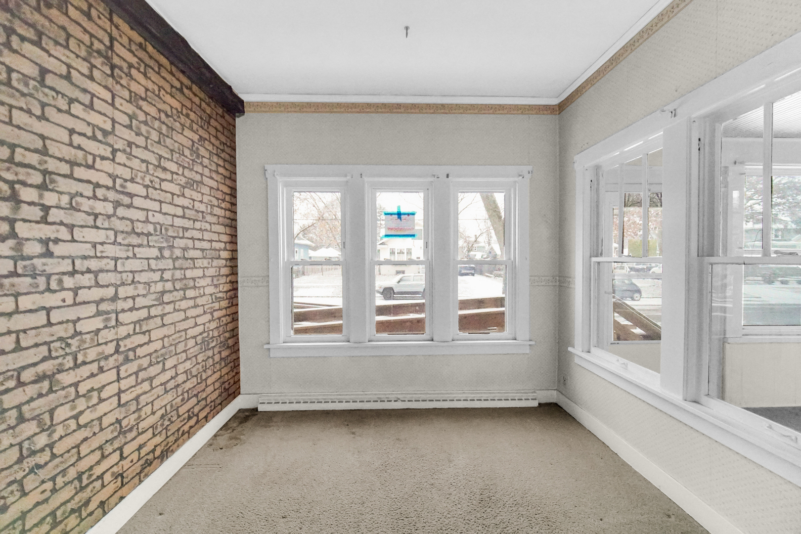 1009 Augusta Avenue Elgin, IL 60120 - Photo 7 of 24 a view of an empty room with a window