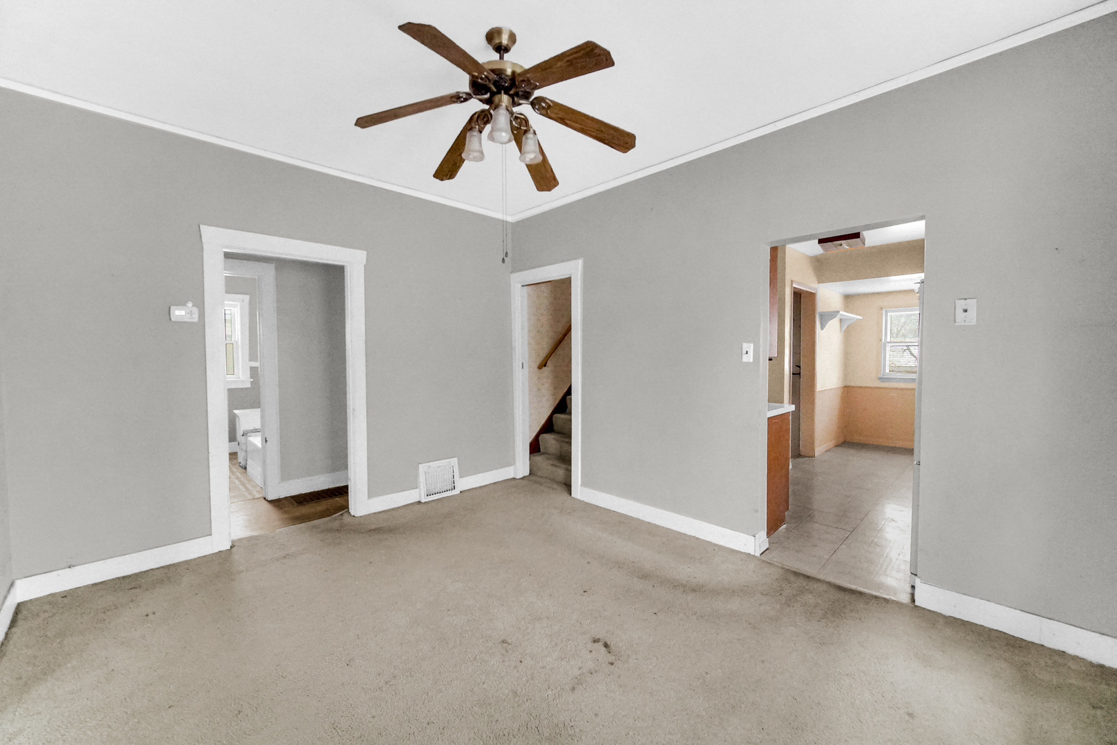 1009 Augusta Avenue Elgin, IL 60120 - Photo 8 of 24 an empty room with fan and a ceiling fan