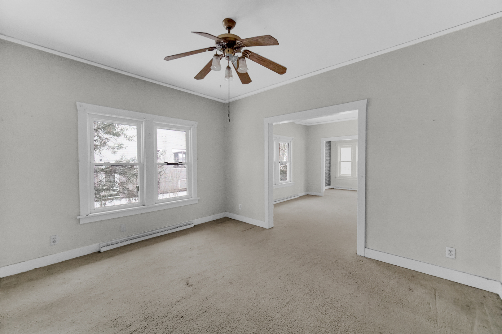1009 Augusta Avenue Elgin, IL 60120 - Photo 9 of 24 a view of an empty room with a window