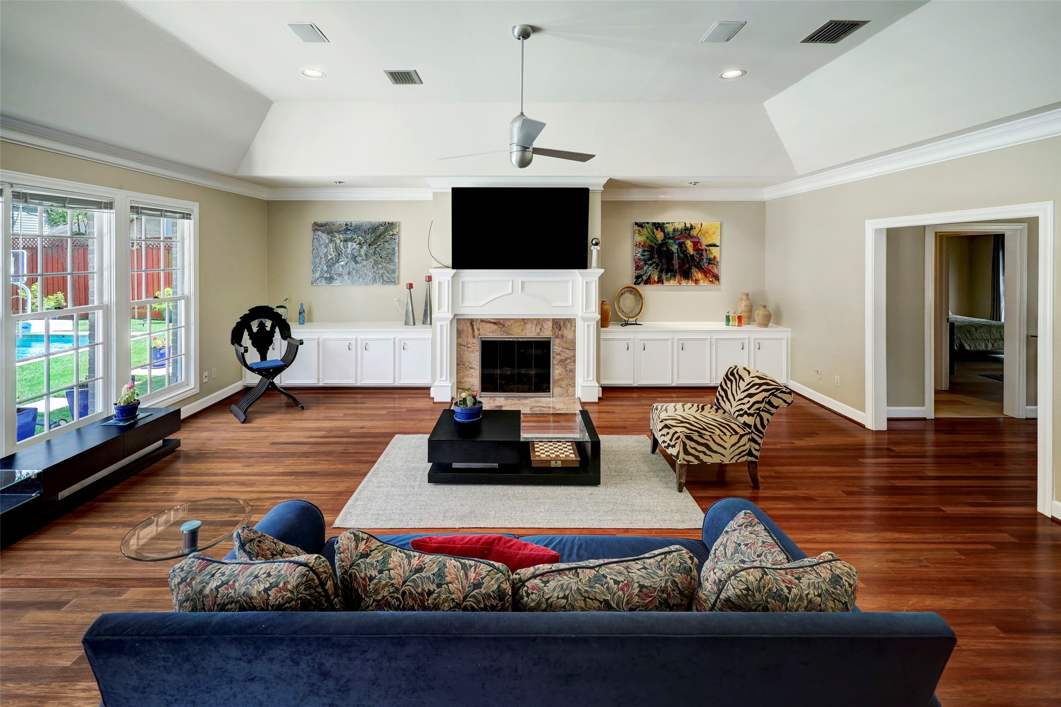 4401 Roseland Street Houston, TX 77006 - Photo 13 of 46 BEAUTIFUL HIGH MANTLED FIREPLACE WITH BALANCED BUILT INS ON BOTH SIDES, HIGH ANGLED COVE CEILING AND RECESSED ART LIGHTING, PERFECT FOR SHOWING OFF YOUR ART PIECES!!!