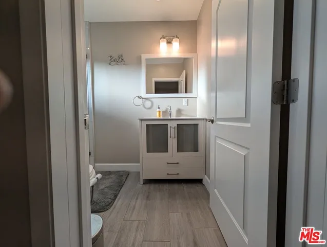 a bathroom with a sink and mirror