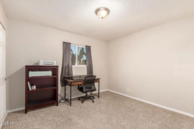 a view of a workspace with furniture