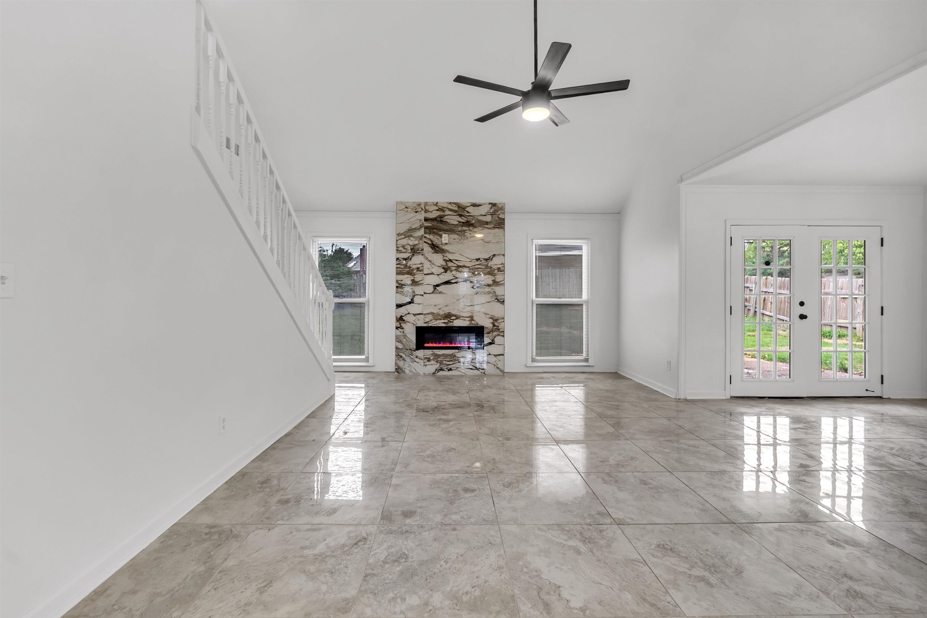 7218 Barnstable Road Memphis, TN 38125 - Photo 4 of 18 Unfurnished living room featuring plenty of natural light, a high end fireplace, ceiling fan, and crown molding