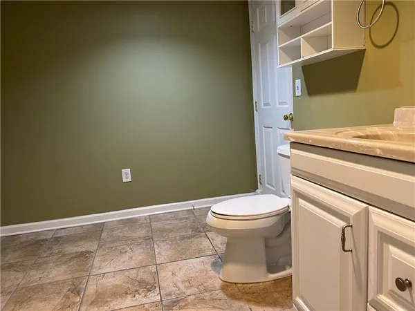 a bathroom with a toilet and a sink
