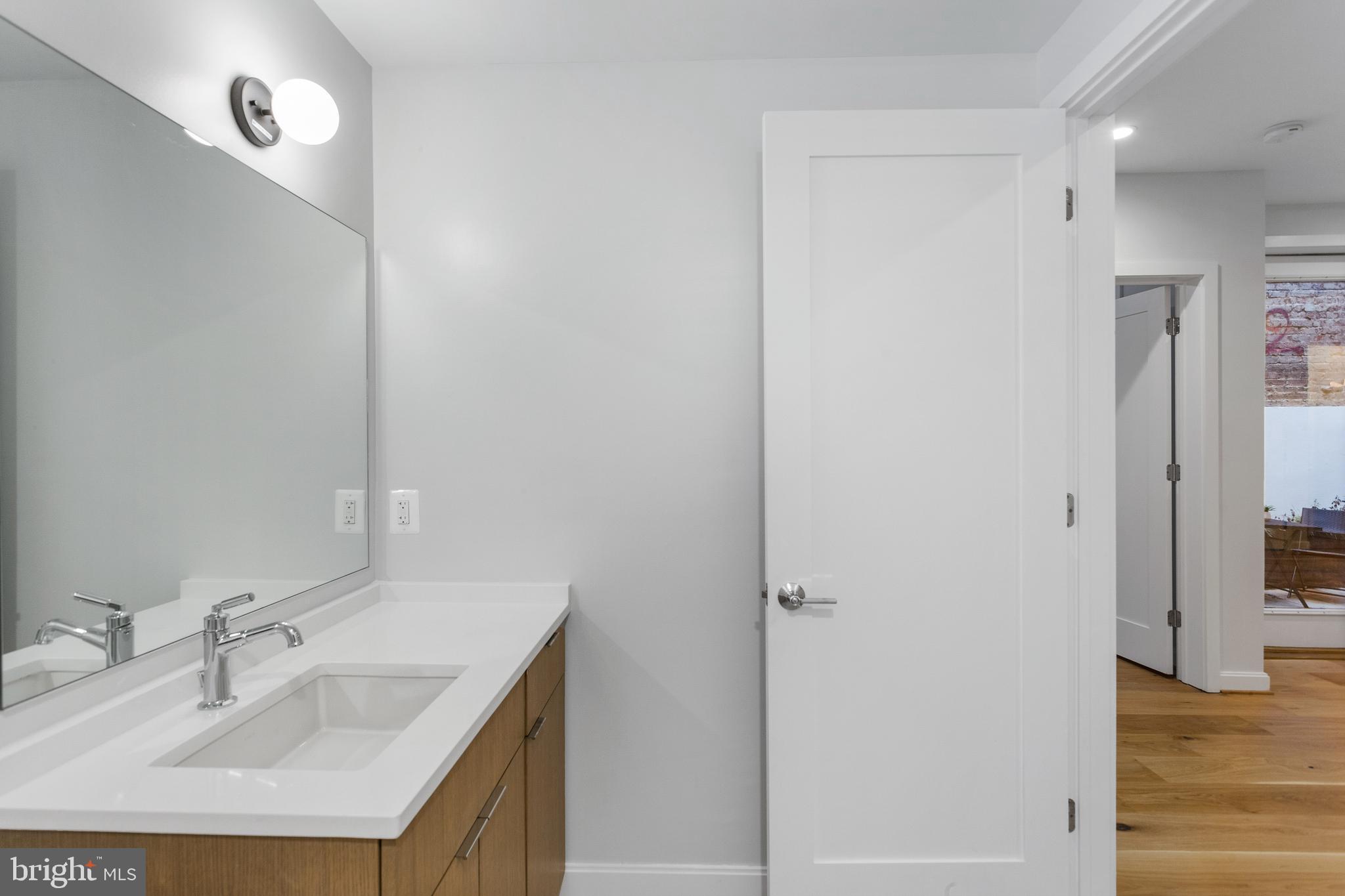 2248 Ontario Road Northwest, Unit 2 Washington, DC 20009 - Photo 21 of 30 Off-center sink for added counter space & storage