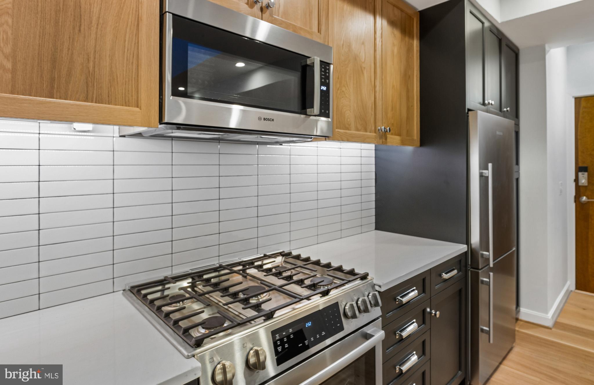 2248 Ontario Road Northwest, Unit 2 Washington, DC 20009 - Photo 6 of 30 Under Cabinet Lighting and hidden outlets