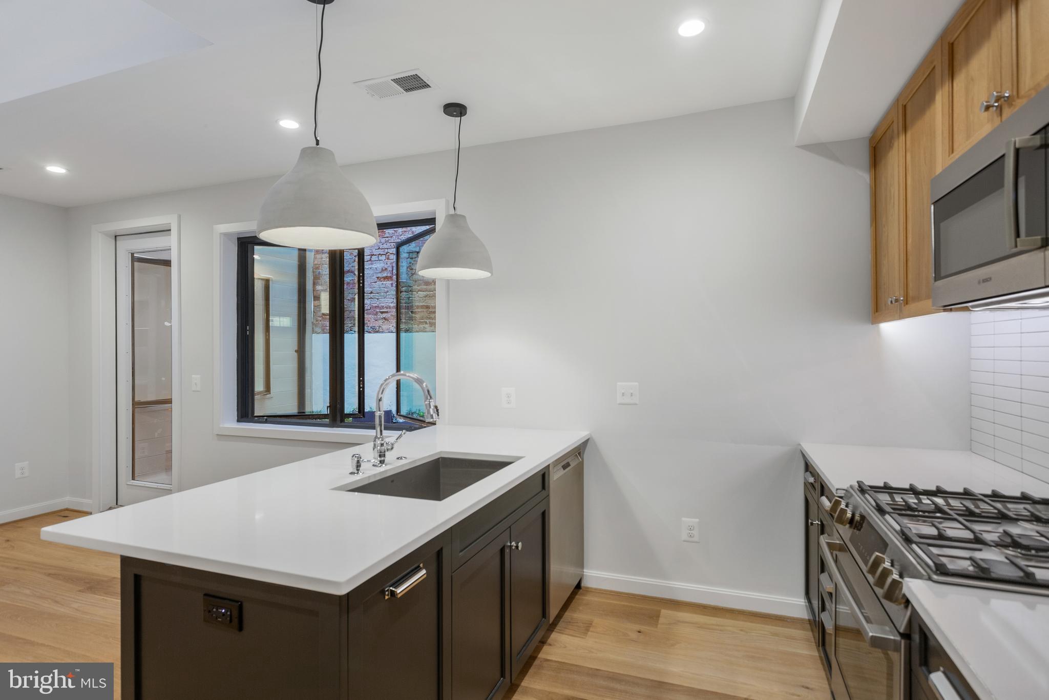 2248 Ontario Road Northwest, Unit 2 Washington, DC 20009 - Photo 8 of 30 Quartz countertops, Concrete Dome Pendants