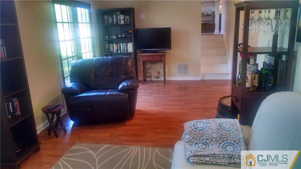 23 Outcalt Road Edison, NJ 08817 - Photo 22 of 25 a living room with furniture and a flat screen tv