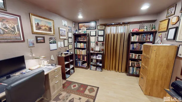 a room with furniture and a bookshelf