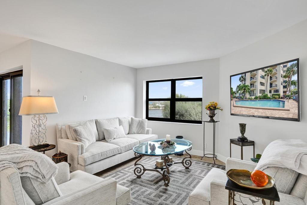 501 North Riverside Drive, Unit 203 Pompano Beach, FL 33062 - Photo 18 of 63 a living room with furniture and a window