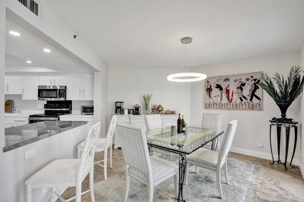 501 North Riverside Drive, Unit 203 Pompano Beach, FL 33062 - Photo 19 of 63 a view of a dining room with furniture