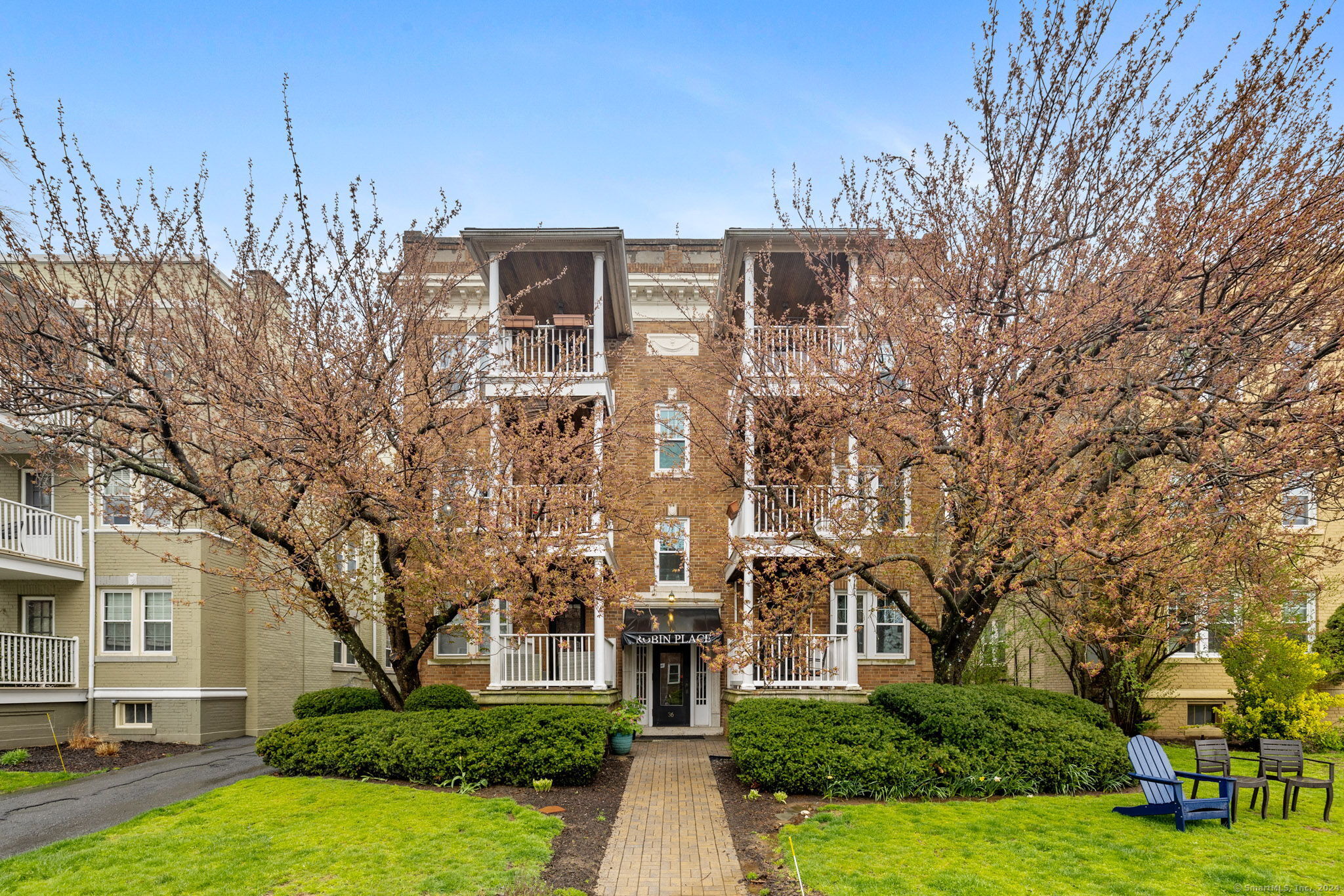 a front view of a house with garden