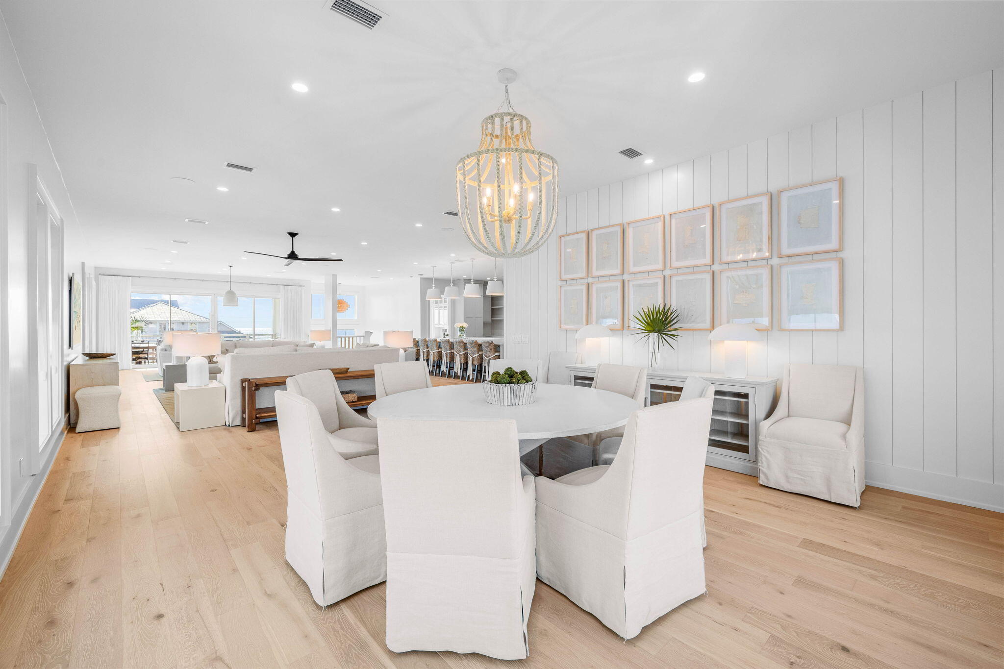 8069 East County Highway 30A Inlet Beach, FL 32461 - Photo 13 of 119 a living room with furniture a chandelier and kitchen view