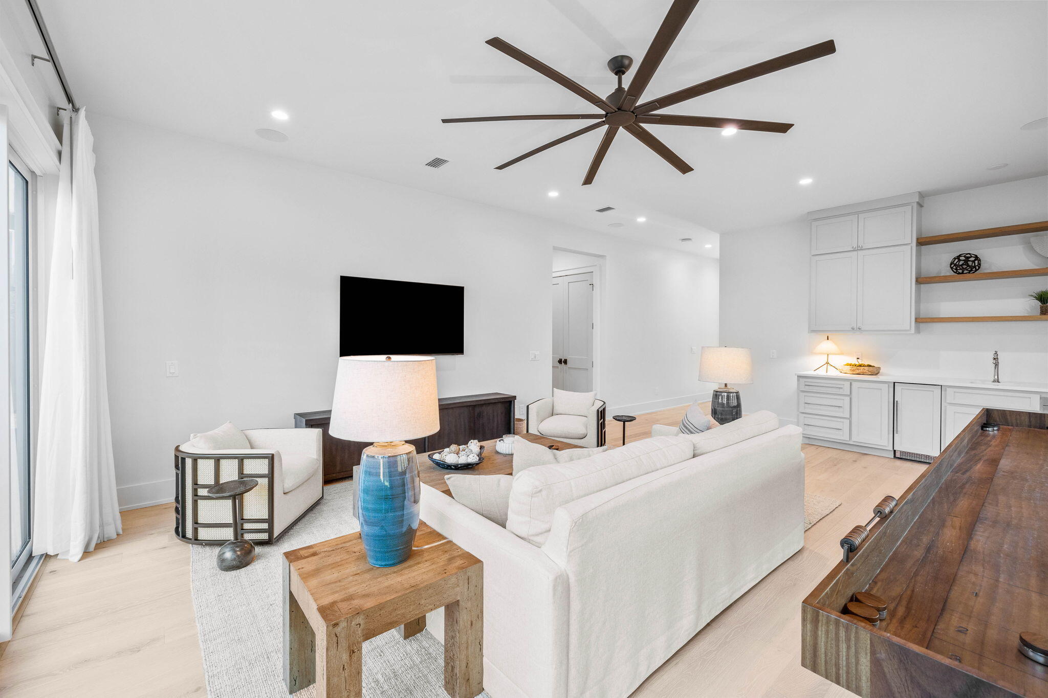 8069 East County Highway 30A Inlet Beach, FL 32461 - Photo 19 of 119 a living room with furniture and a flat screen tv