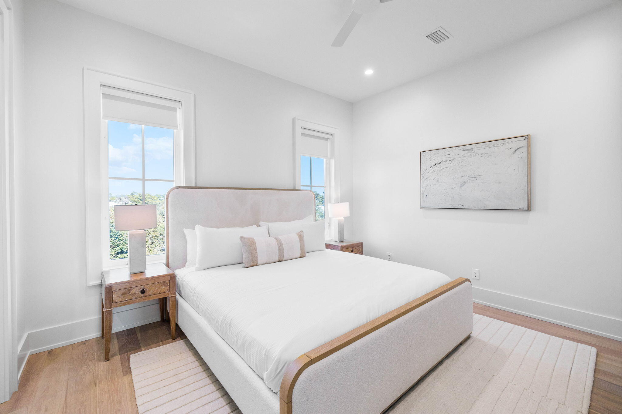 8069 East County Highway 30A Inlet Beach, FL 32461 - Photo 72 of 119 a bedroom with a bed and a night stand