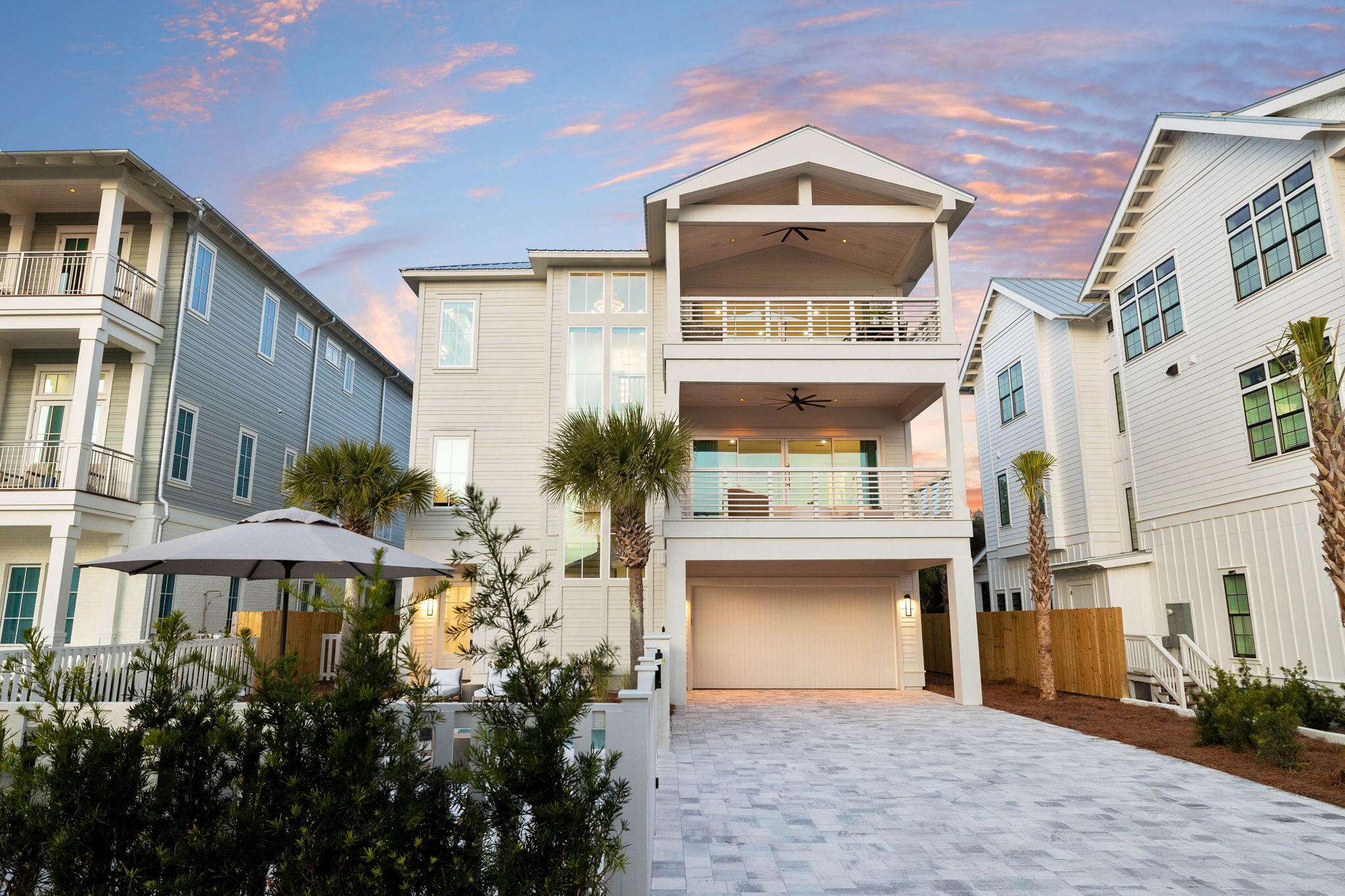 8069 East County Highway 30A Inlet Beach, FL 32461 - Photo 82 of 119 a front view of a building with a garden