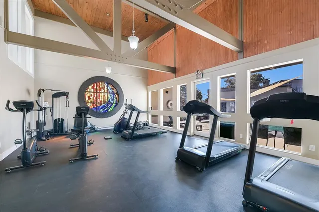 a room with lots of furniture and a chandelier