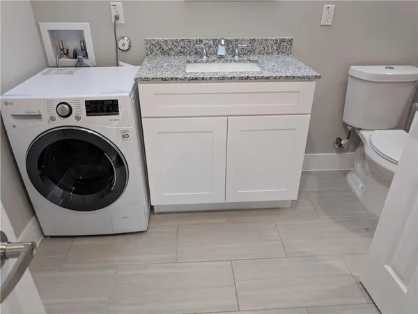 a utility room with dryer and washer