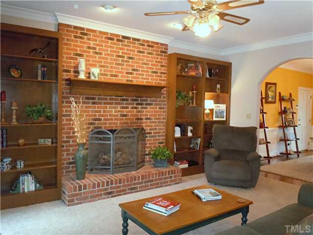 4620 Thendara Way Raleigh, NC 27612 - Photo 2 of 18 COZY FAMILY ROOM WITH MASONRY FIREPLACE / GAS LOGS..9 FT. CEILINGS..ARCHED OPENING TO DINING ROOM. Living Room