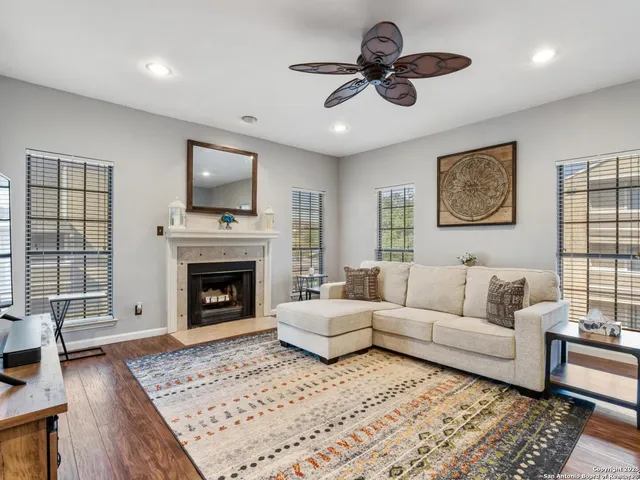 a living room with furniture and a fireplace