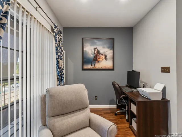 a living room with furniture and a window