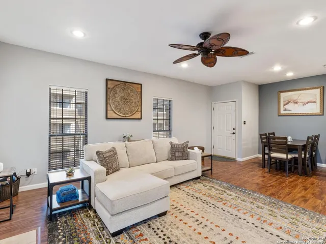 a living room with furniture and a rug