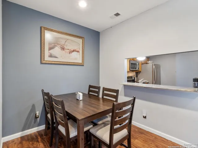 a view of a dining room with furniture