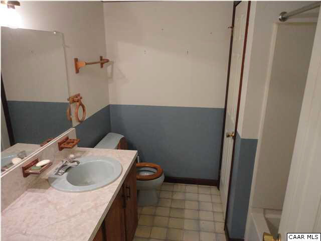 167 Jacks Shop Road Rochelle, VA 22738 - Photo 14 of 20 a bathroom with a sink a vanity and a mirror