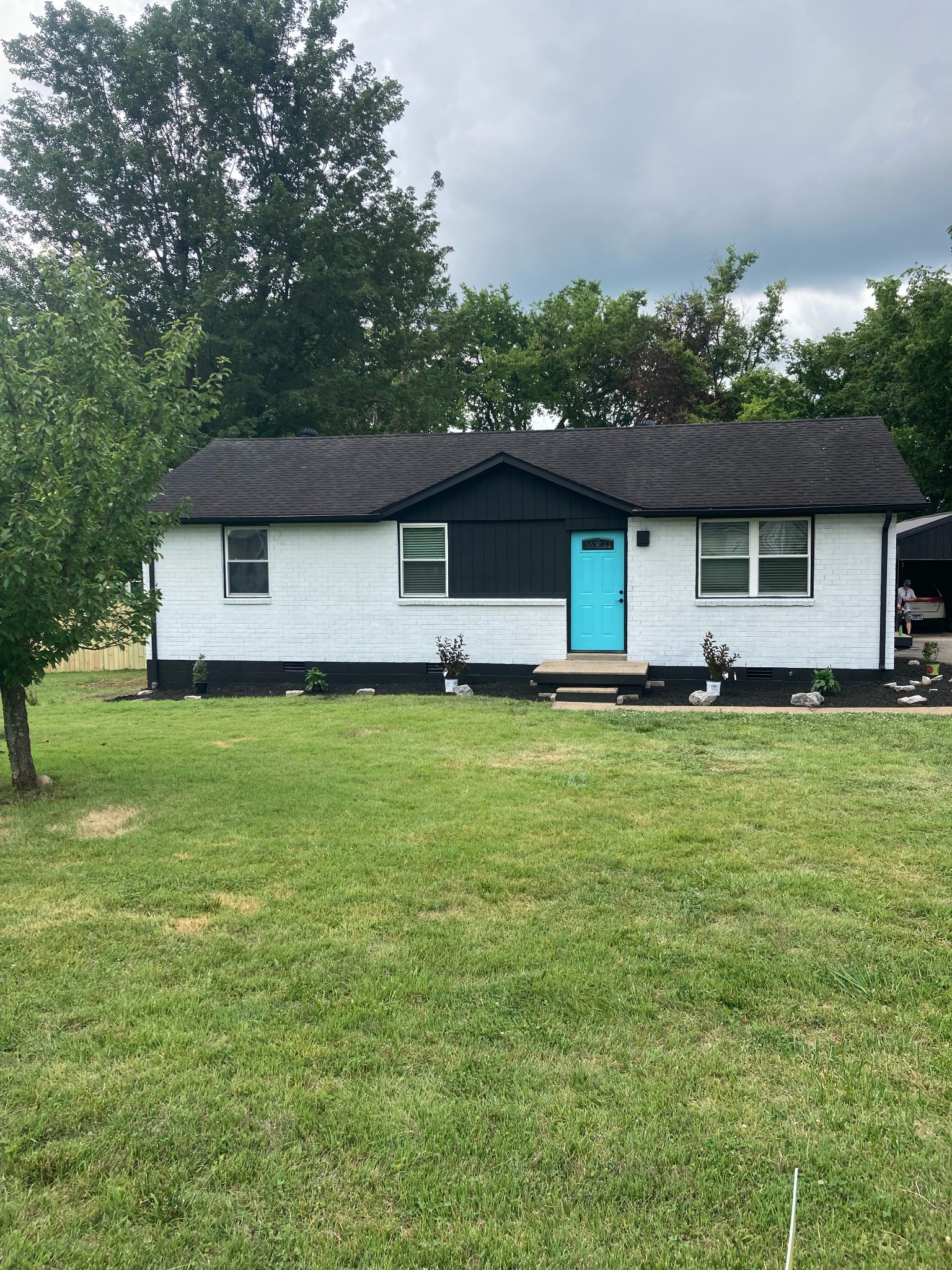 a front view of house with yard and green space