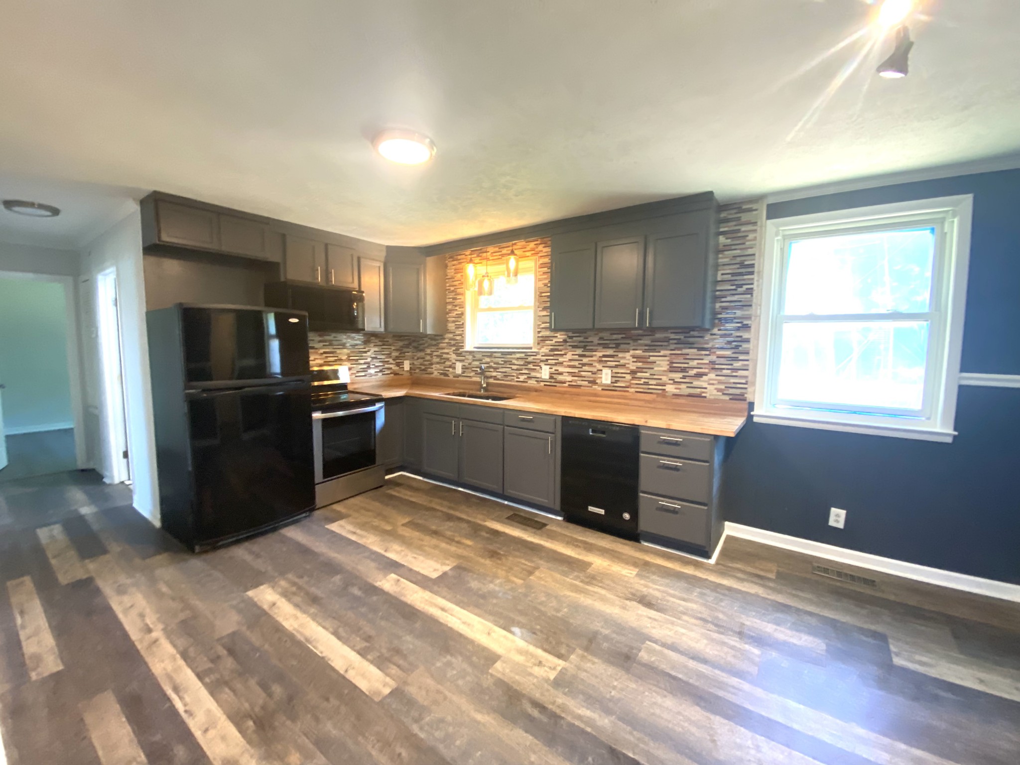 508 Roundup Road Smyrna, TN 37167 - Photo 11 of 33 a kitchen with stainless steel appliances granite countertop a stove a sink and a refrigerator
