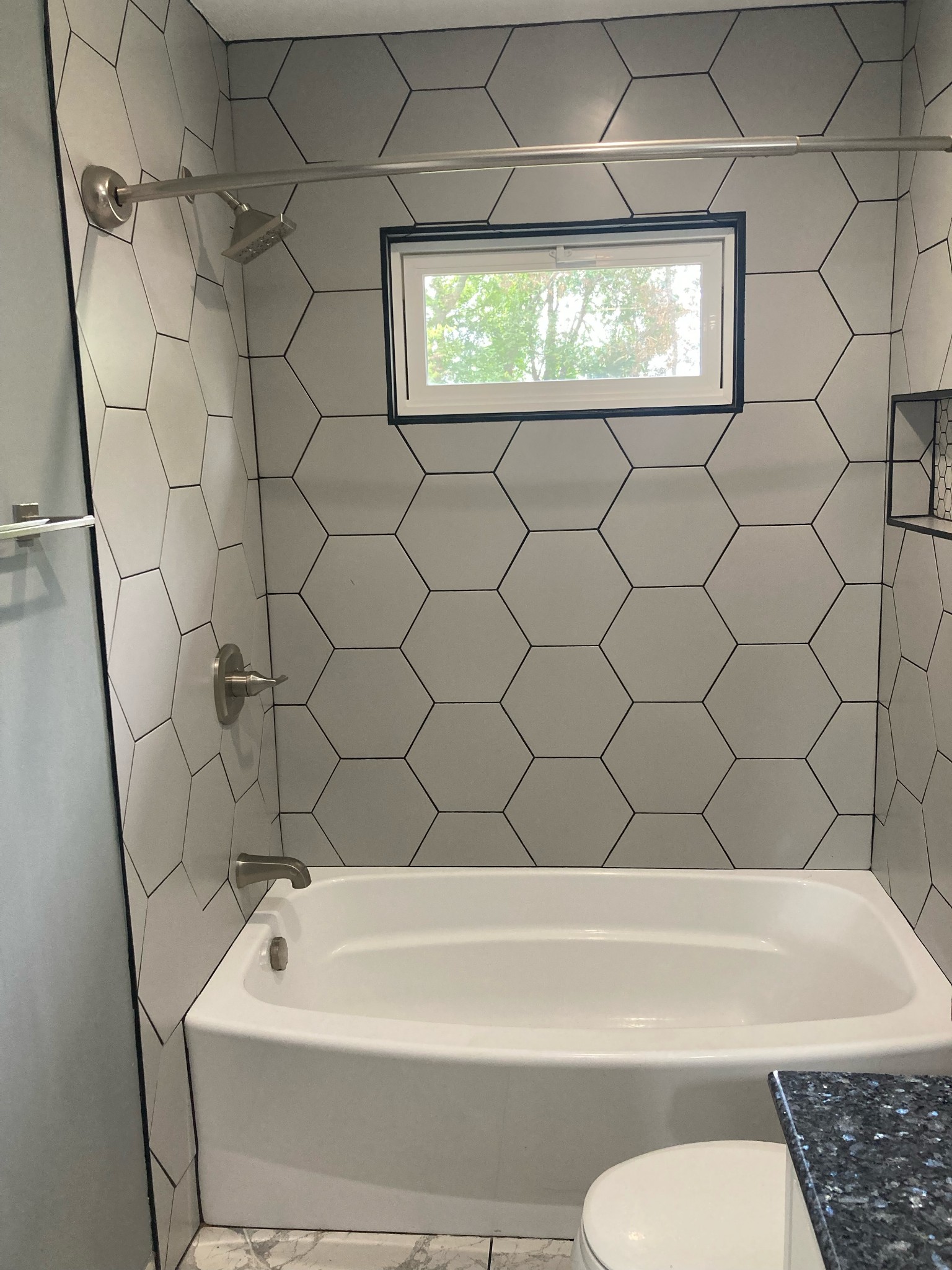 508 Roundup Road Smyrna, TN 37167 - Photo 18 of 33 a bathroom with a bathtub and window