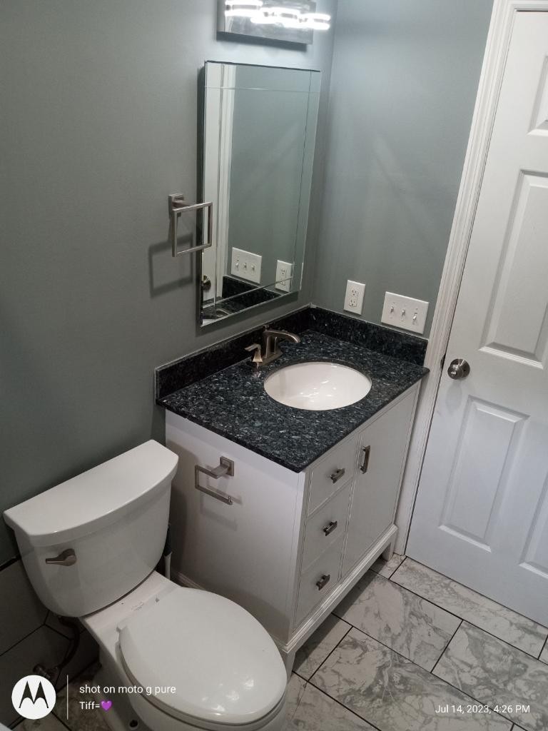 508 Roundup Road Smyrna, TN 37167 - Photo 22 of 33 a bathroom with a granite countertop toilet sink and mirror