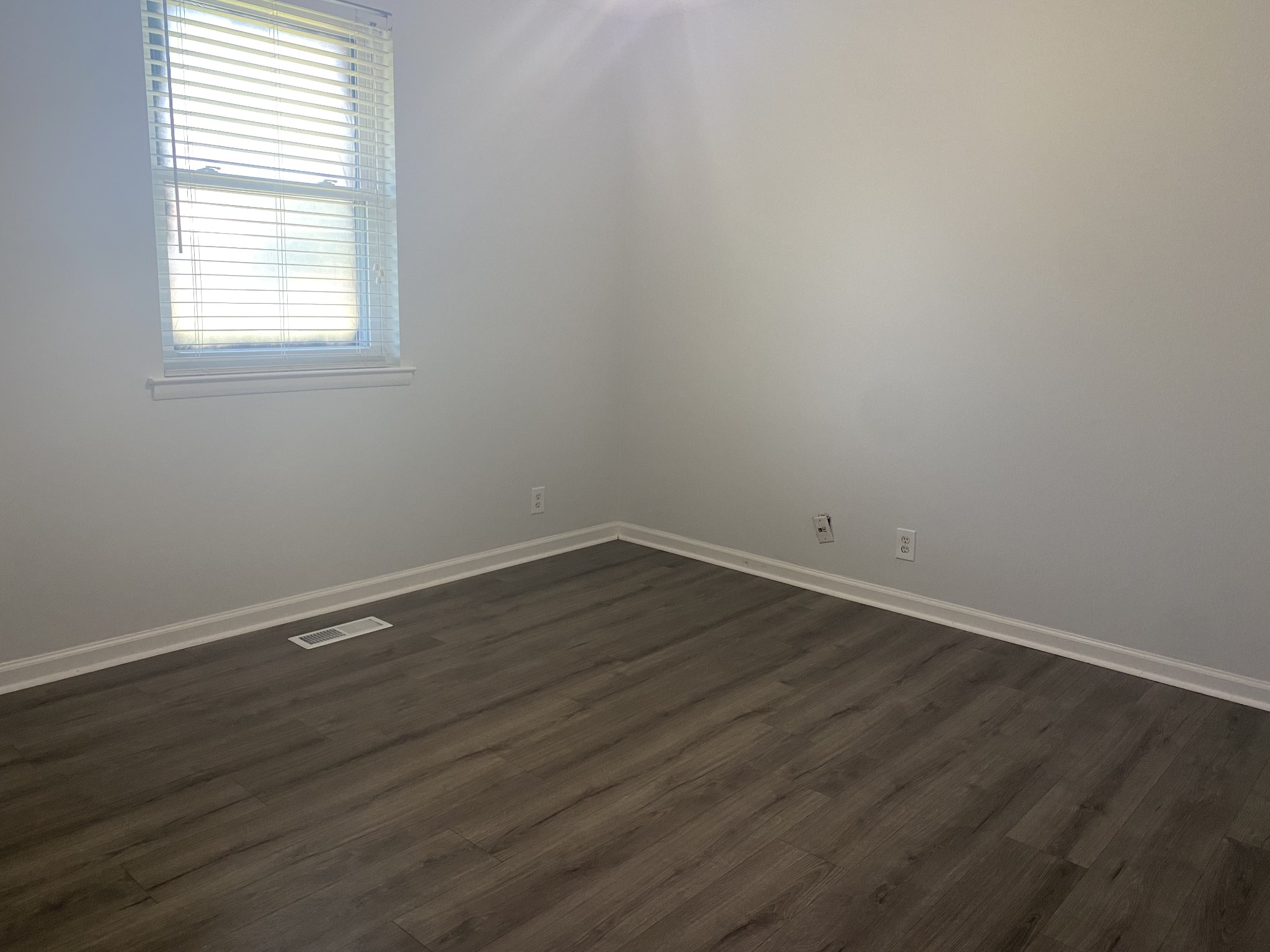 508 Roundup Road Smyrna, TN 37167 - Photo 24 of 33 an empty room with wooden floor and windows