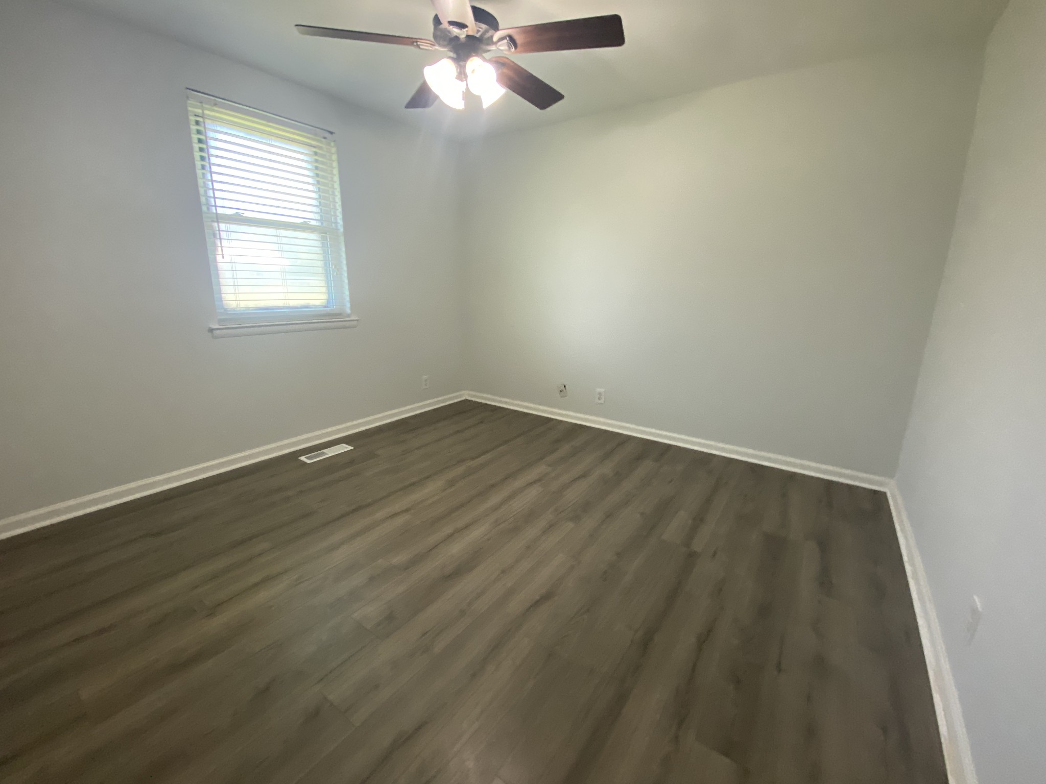 508 Roundup Road Smyrna, TN 37167 - Photo 27 of 33 an empty room with wooden floor and windows