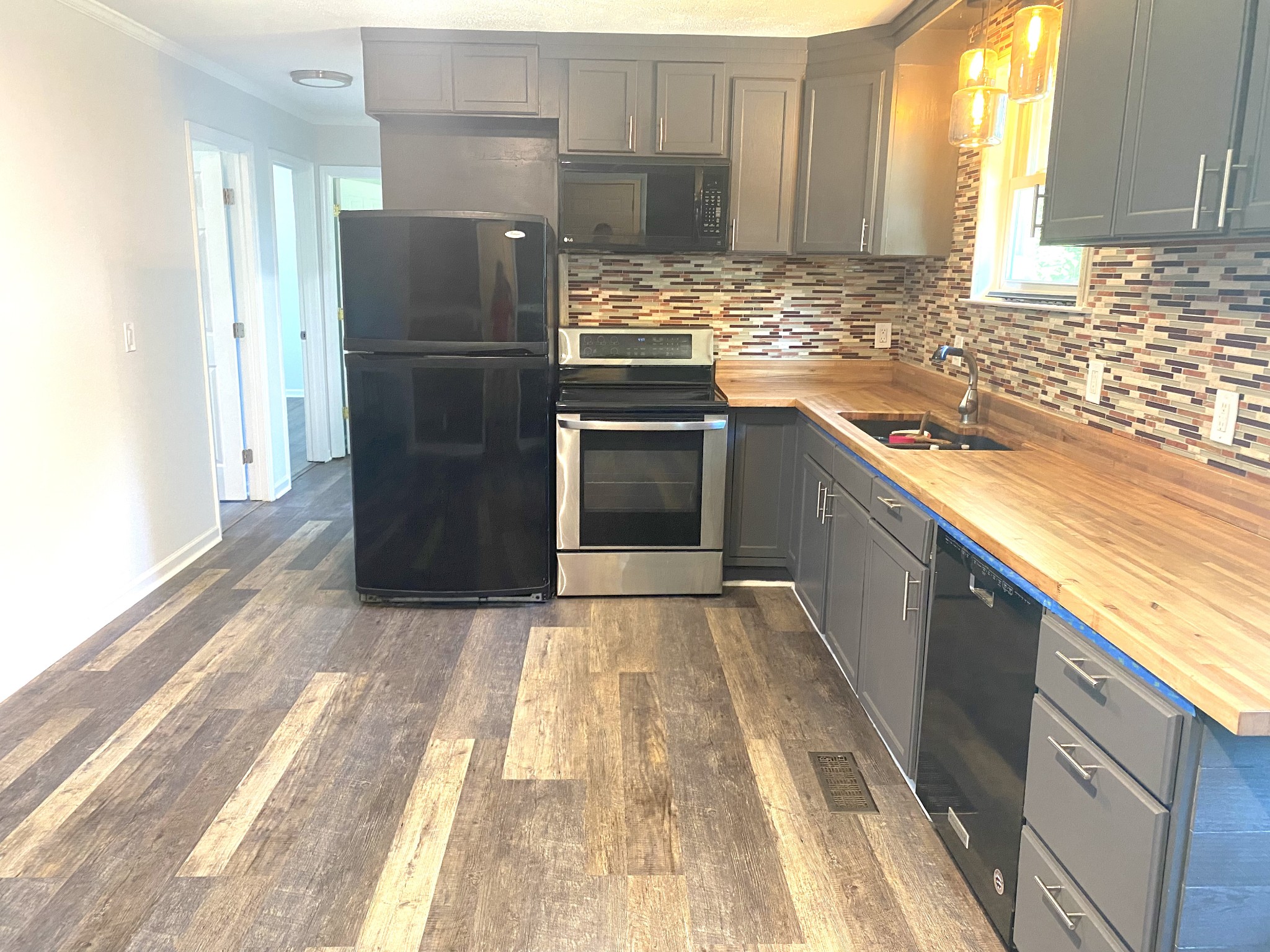 508 Roundup Road Smyrna, TN 37167 - Photo 9 of 33 a kitchen with granite countertop a refrigerator and a sink