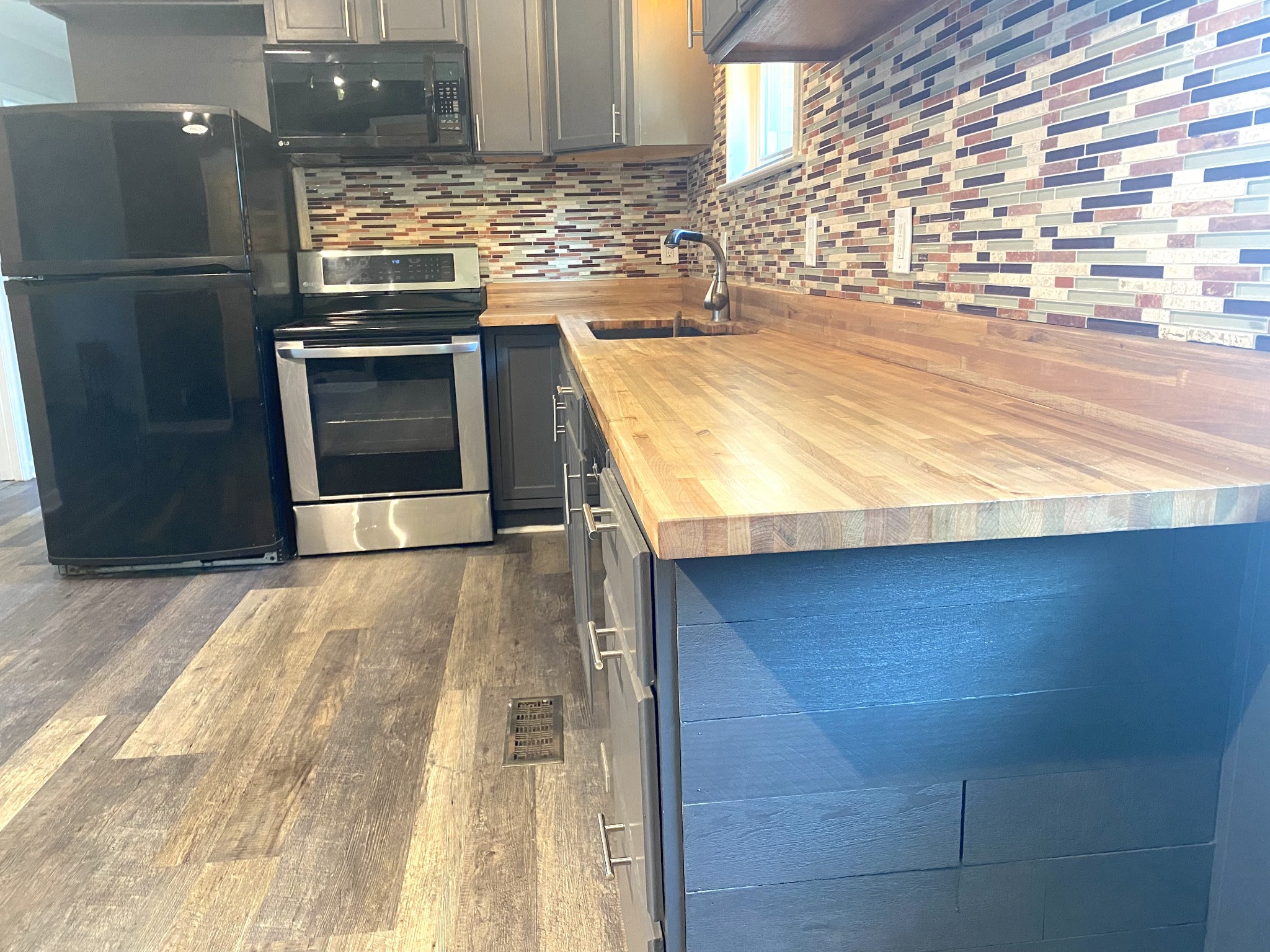 508 Roundup Road Smyrna, TN 37167 - Photo 10 of 33 a kitchen with granite countertop sink and stainless steel appliances