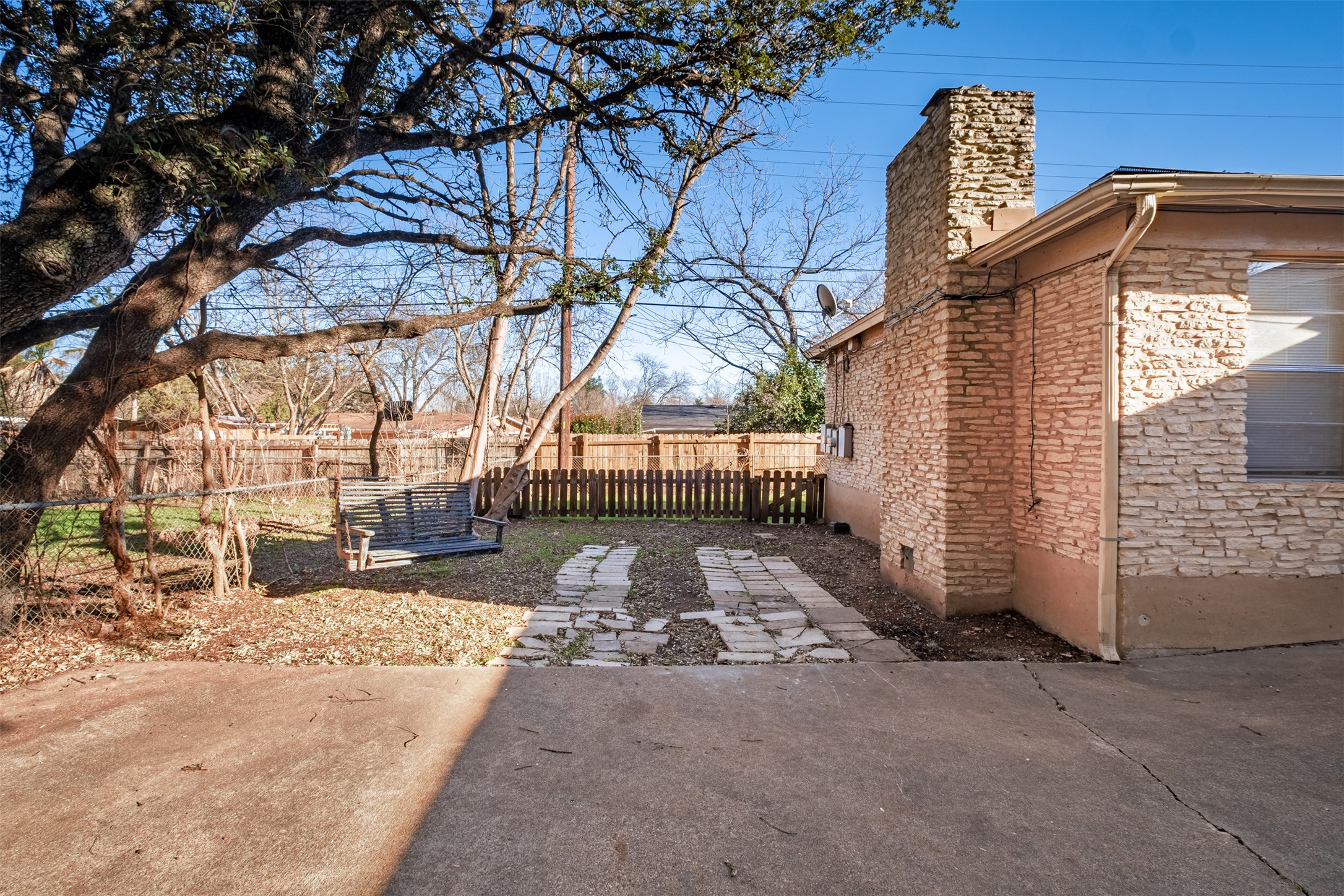 5801 Libyan Drive, Unit B Austin, TX 78745 - Photo 18 of 20 Fenced backyard with a patio