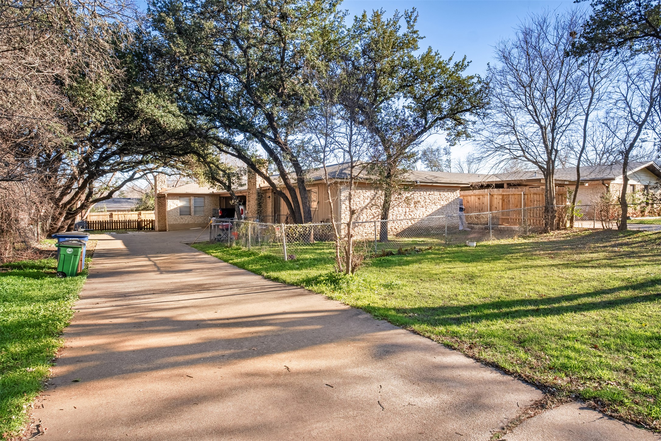 5801 Libyan Drive, Unit B Austin, TX 78745 - Photo 2 of 20 Ranch-style house with a fenced front yard and brick siding