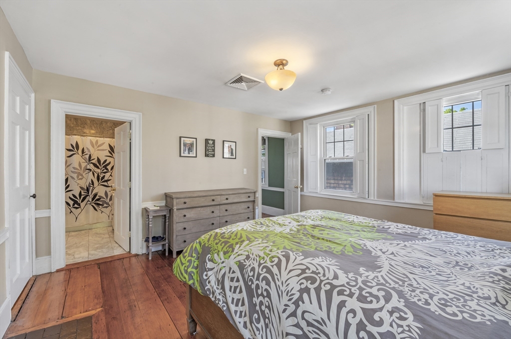 11 Williams Street, Unit 2 Salem, MA 01970 - Photo 20 of 33 a bedroom with a bed and a dresser