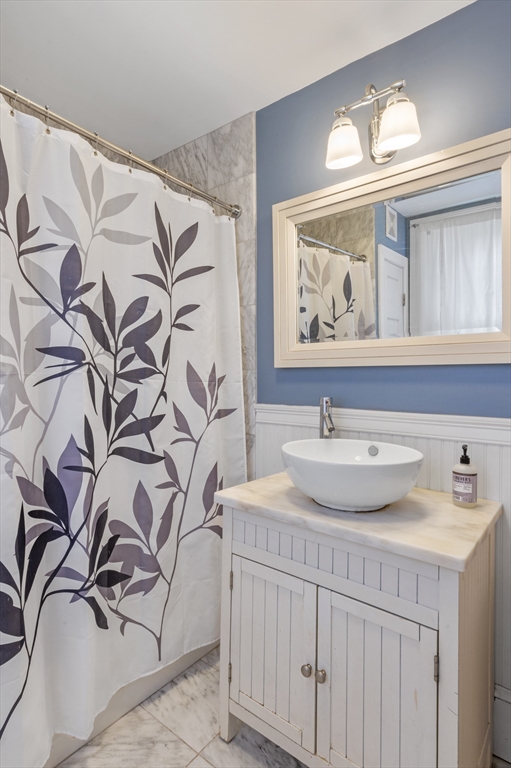 11 Williams Street, Unit 2 Salem, MA 01970 - Photo 21 of 33 a bathroom with a sink and a mirror