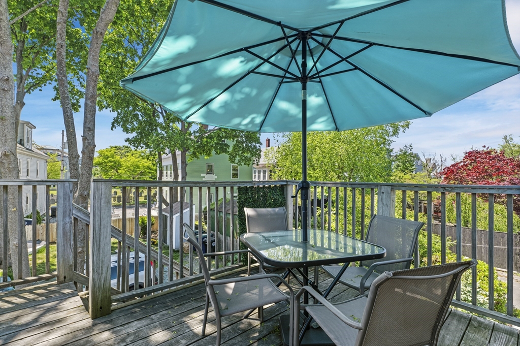11 Williams Street, Unit 2 Salem, MA 01970 - Photo 26 of 33 a view of a balcony with furniture and wooden floor