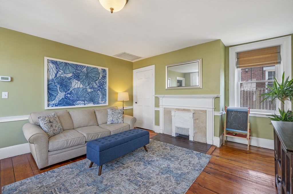 11 Williams Street, Unit 2 Salem, MA 01970 - Photo 3 of 33 a living room with furniture and a fireplace