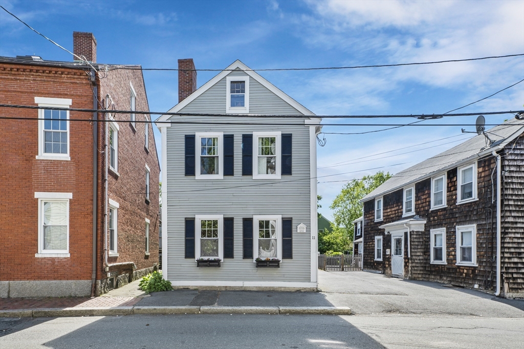 11 Williams Street, Unit 2 Salem, MA 01970 - Photo 32 of 33 a front view of a building with a yard