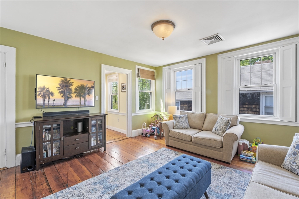 11 Williams Street, Unit 2 Salem, MA 01970 - Photo 5 of 33 a living room with furniture and a flat screen tv