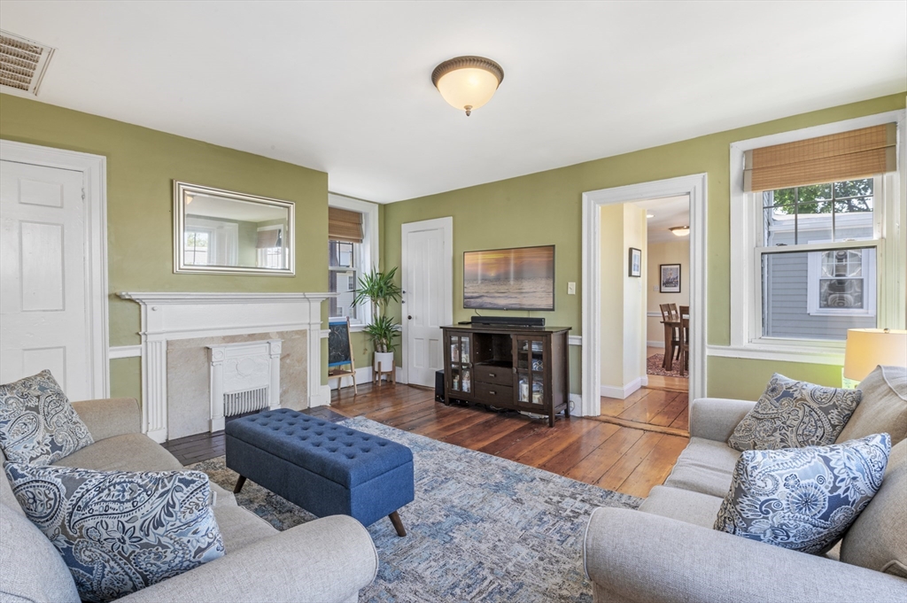 11 Williams Street, Unit 2 Salem, MA 01970 - Photo 6 of 33 a living room with furniture and a fireplace