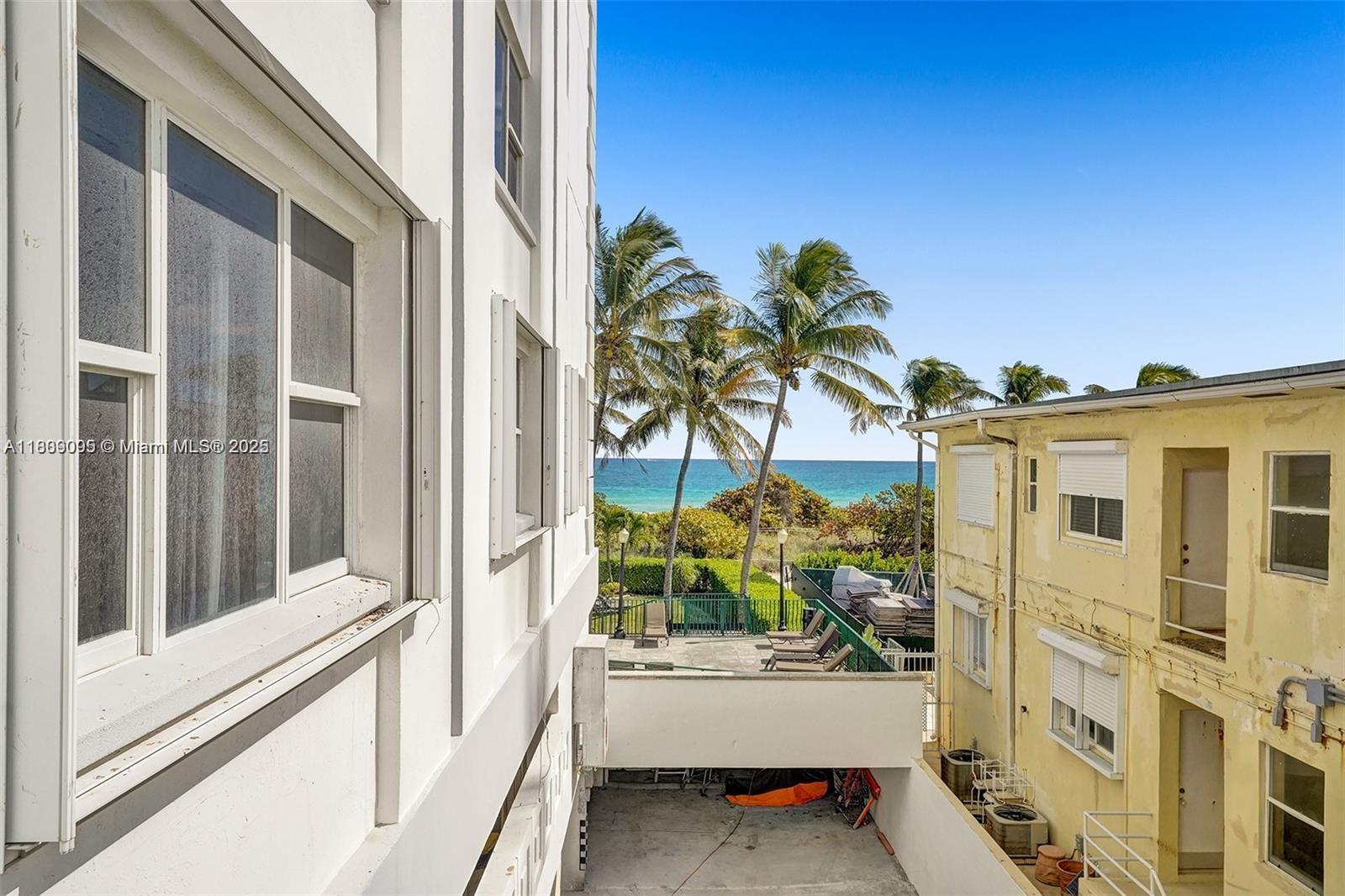 9195 Collins Avenue, Unit 304 Surfside, FL 33154 - Photo 21 of 32 a view of front door and potted plants